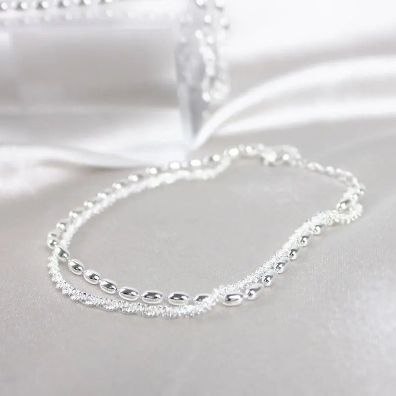 Elegant set of silver bracelets with zirconia stones