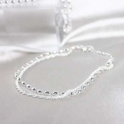 Elegant set of silver bracelets with zirconia stones