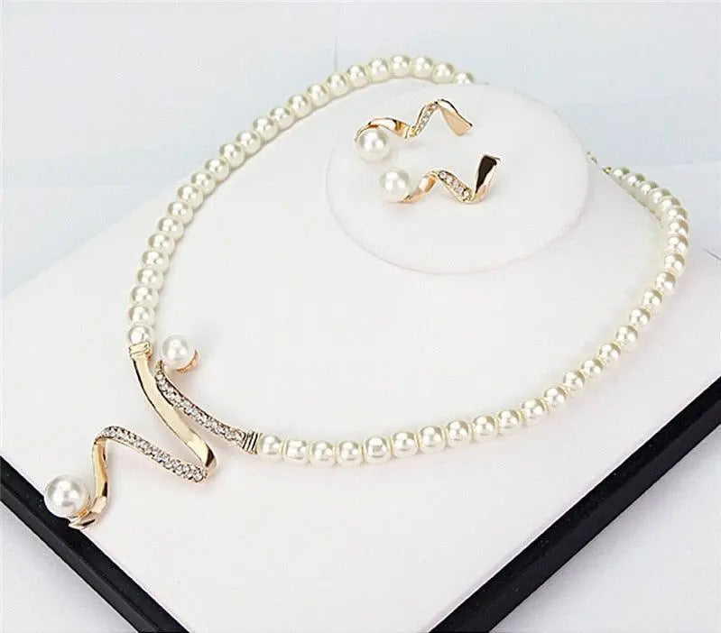 Set of a necklace and earrings with natural pearls