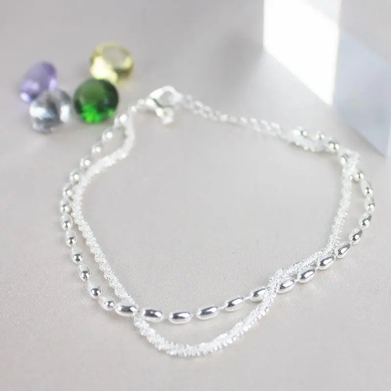 Elegant set of silver bracelets with zirconia stones