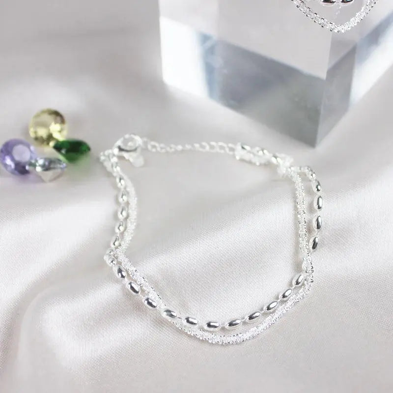 Elegant set of silver bracelets with zirconia stones