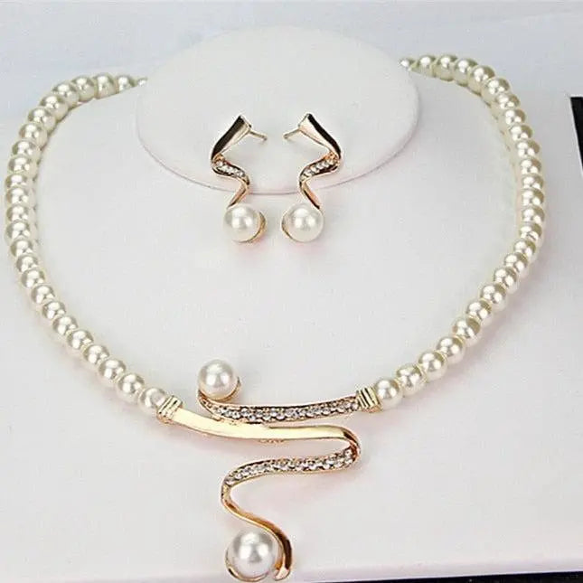Set of a necklace and earrings with natural pearls