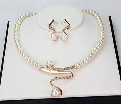 Set of a necklace and earrings with natural pearls