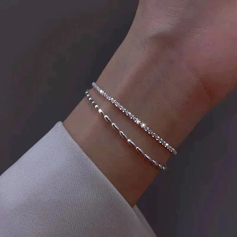 Elegant set of silver bracelets with zirconia stones
